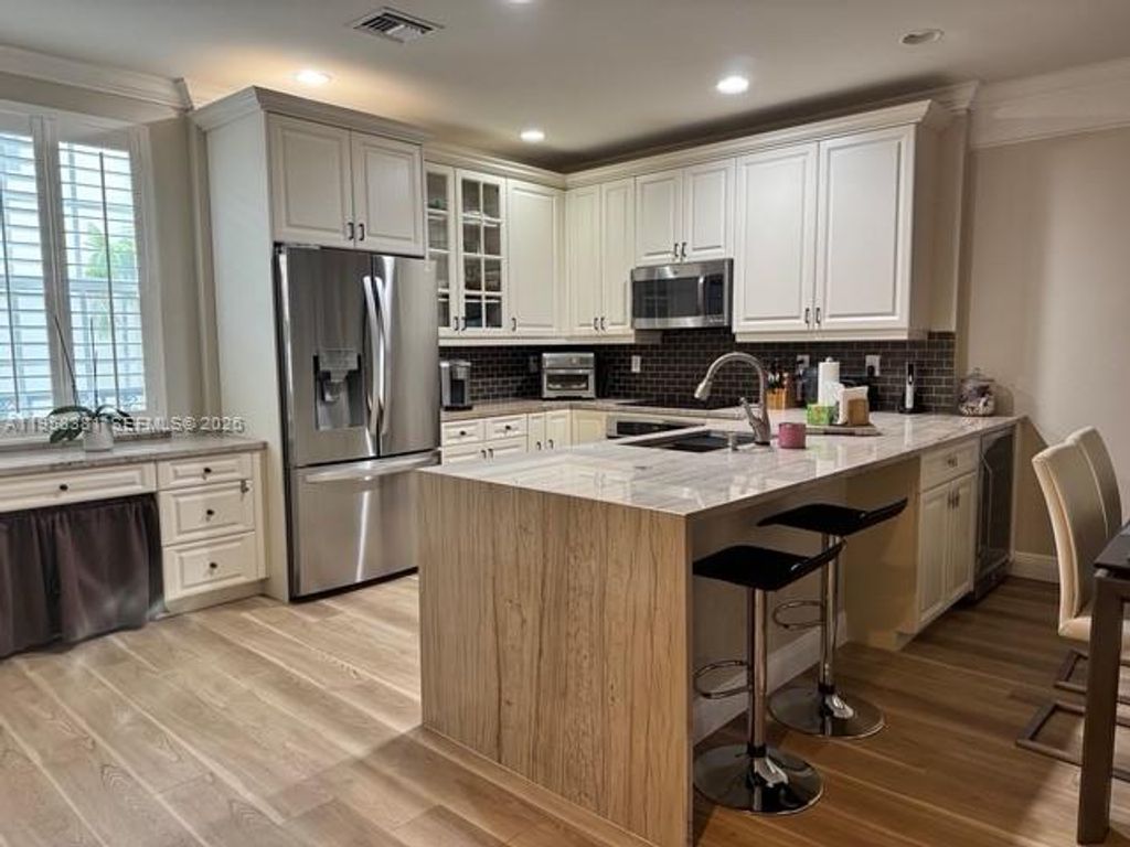 Photo of 1049 W Heritage Club Cir, Delray Beach, FL 33483 (MLS # A11958381)