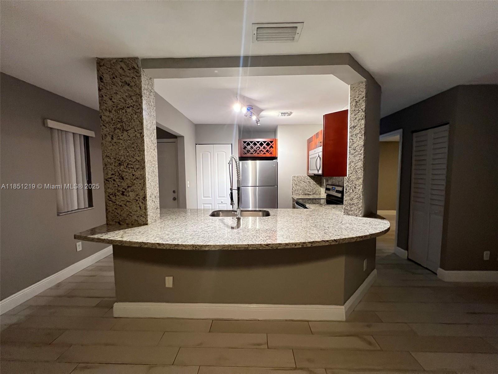 Newly renovated 1 bed / 1 bath condo with in-unit washer and dryer, located on the first floor with easy access to open green space and scenic lake views. Features granite countertops, stainless steel appliances, porcelain tile throughout (no carpet), and updated fixtures. Gated community offers resort-style amenities including a heated pool, fitness center, tennis court, Jacuzzi, dog park, dog wash, car wash, BBQ area, and lighted walking path. Enjoy boating, fishing pier access, and serene 23-acre lake views. Pet-friendly—large dogs and cats welcome. Conveniently located near I-95, Turnpike, shops, restaurants, and more.
