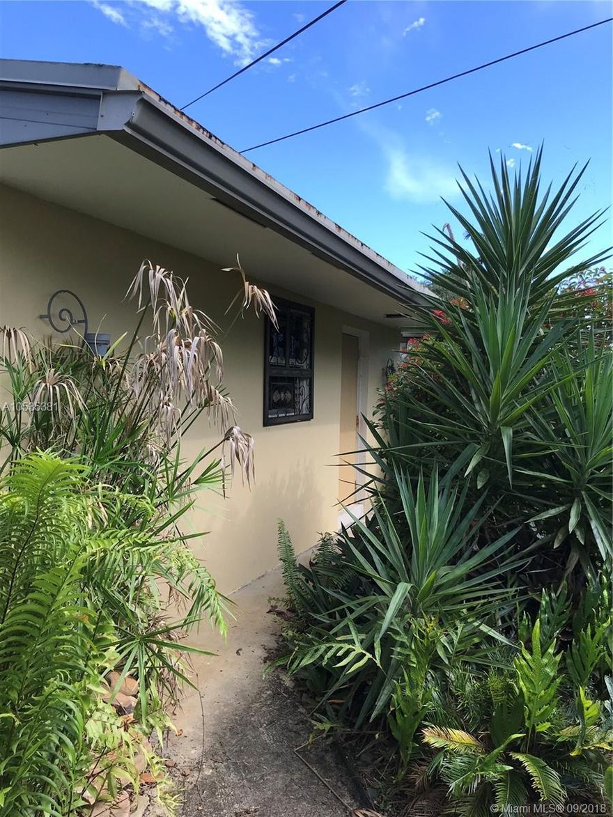 Detached cottage, in a tropical garden setting behind the main home. Renovated 2013  newer kitchen w/ granite counters, tile and tile & wood laminate floors..The cottage has its own private walk out porch/patio area in the back off the living room. Washer & Dryer in the carport shared w/ main house. Off street Slab parking for 2 cars. Great location. . Pet deposit $250 nonrefundable. Wall A/C in main room and a 2nd A/C in the bedroom. If you are looking for a secluded peaceful quiet cottage home in a tropical setting this one bedroom cottage is a great alternative to condo living. Plenty of space in the back yard garden patio area to make it your own.