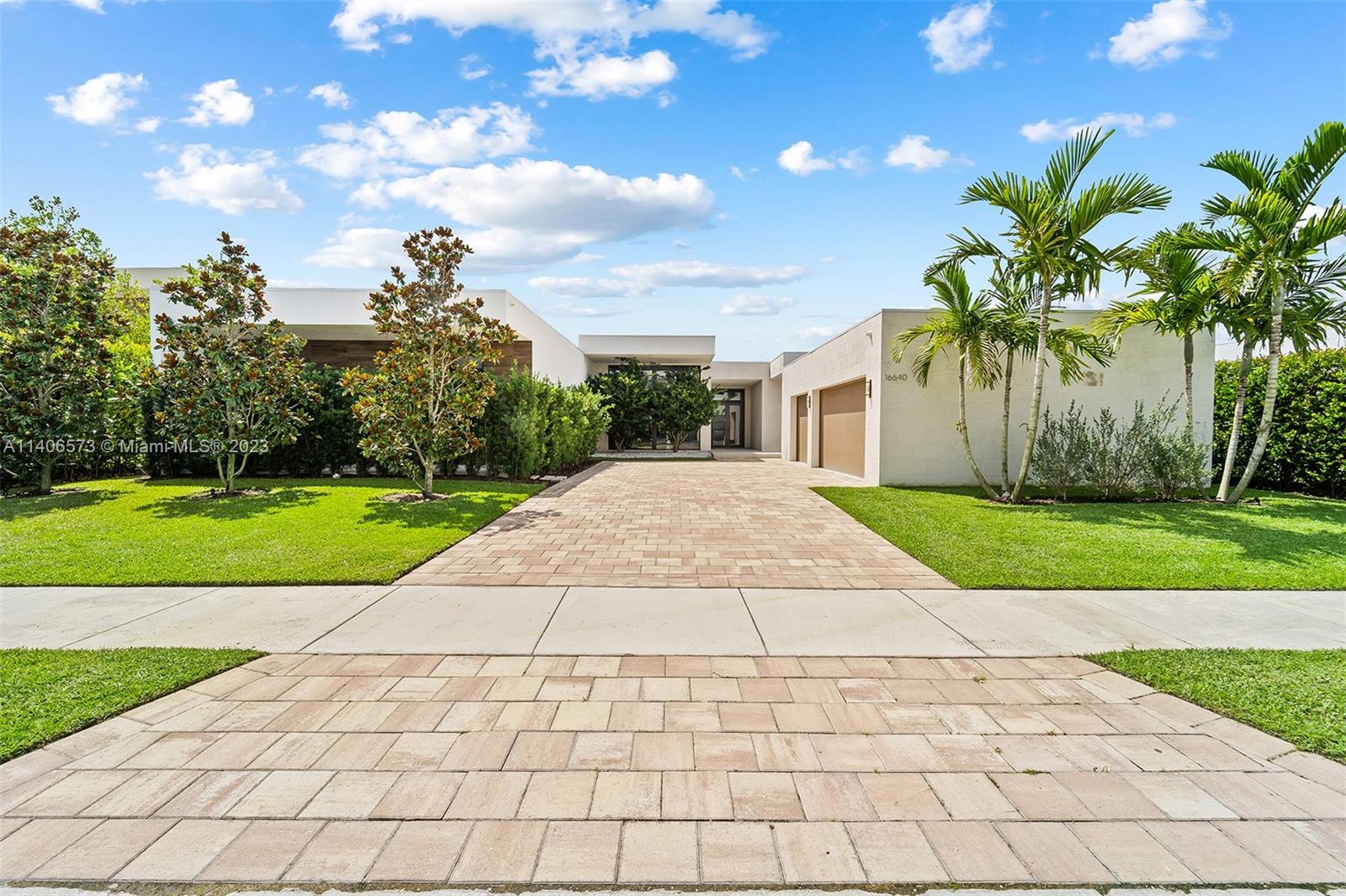 Modern Living in the exclusive gated community of Botaniko Estates. This newly constructed 7,093 sqft lakefront residence offers 6 suits, 7.5 baths, media room, 3 car garage cover + driveway, gourmet chef-inspired kitchen with gas stove, top of the line appliances, smart home technology, porcelain + summer kitchen, private swimming pool and lush landscape. One of the largest homes with one floor in the community. Botaniko is a private enclave of 120 modern luxury residences designed by award winning architect Chad Oppenhein located in Weston. Minutes away from top schools, Sawgrass Mall and 20 minutes drive to FLL.