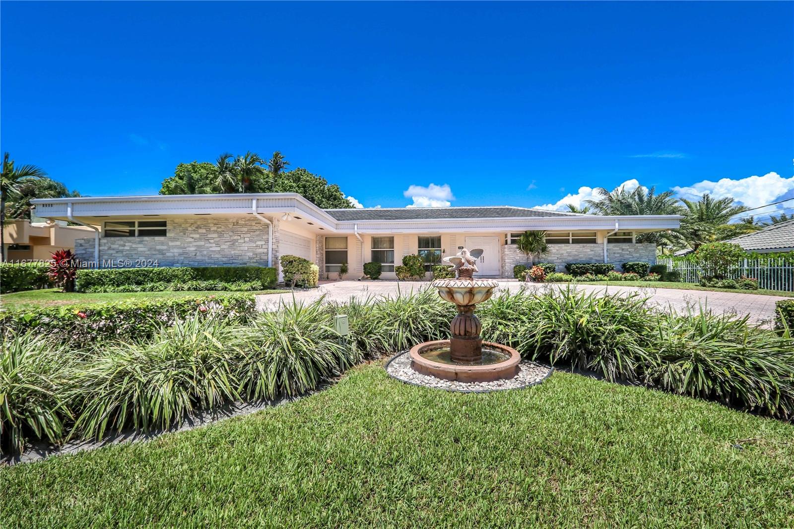 Spectacular 4BR/3.5BA Home with Stunning Water Views! This spacious residence features a den, a 2-car garage, and marble flooring in the entryway. The updated eat-in kitchen boasts an island, stainless steel appliances, and a light granite backsplash with black granite countertops. Enjoy a split floor plan with living and family rooms, each bedroom with its own bathroom, and a luxurious primary suite with dual closets and access to a screened patio and pool. Additional highlights include a large screened-in porch, expansive laundry, and storage rooms. Located on Diplomat Parkway, close to the beaches, fine dining, shopping, Aventura, Gulfstream and so much more.
