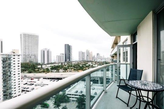 Discover the epitome of coastal luxury in this bright, renovated 1+1 home boasting spectacular ocean and city views. Impeccable design features include flawless flooring, custom cabinetry, a gourmet kitchen with granite counters, and tastefully remodeled bathrooms. The open layout offers stunning sunrise right from your living room. Situated in a prime Sunny Isles location, you're minutes from beautiful beaches, shopping, dining, and the famous Aventura Mall. This full-service building offers resort-style amenities including a swimming pool overlooking the intracoastal, fitness center, recreation room, and convenience store. Enjoy 24-hour valet and security, with maintenance covering cable, and WiFi. Embrace luxury living at its finest!