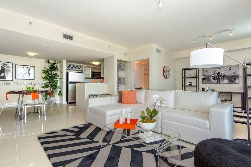 Spacious 1-bedroom, 2-bath with den converted into a second bedroom, totaling 818 SF. Features a generous balcony with beautiful river and park views. Bright open layout with versatile living space, ideal for relaxing or working from home.