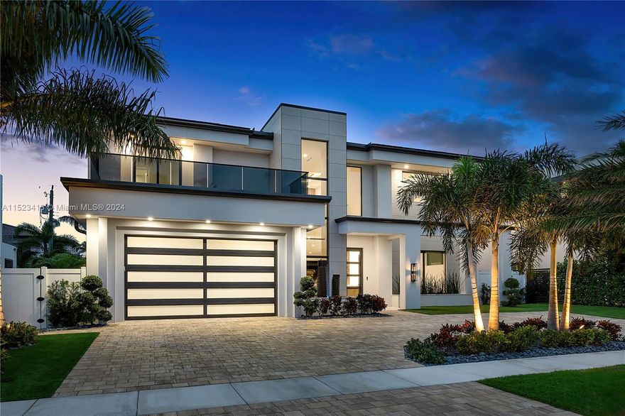 Welcome to luxury living in Boca Villas, Boca Raton's premier neighborhood. This contemporary gem, just steps from Downtown and a mile from the beach, offers 4900 sq ft of opulent space. Open floor plan with 5 beds and 6 baths, each adorned in natural stone, including a primary suite upstairs and a VIP suite downstairs, comfort meets elegance. Smart home automation by Control 4 and Leviton, elevator, Miele appliances, and porcelain floors downstairs with oak wood floors upstairs. Luxurious touches abound with Brizo fixtures throughout, a central vacuum, and backlit quartz wine bars on both levels. Step outside to a full outdoor covered kitchen and bar, heated spa, and artificial turf throughout. Complete with a 40kw full house generator, this home redefines luxury living in Boca Raton.