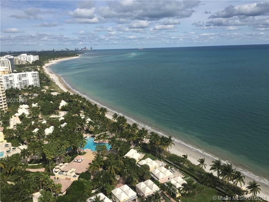 Spectacular and unobstructed views towards the North, Crandon Park and the beaches beyond. See the city lights sparkle and Biscayne Bay shine from this remodeled and updated, gorgeous apartment in the sky. Three large bedrooms/ 3 baths , eat -in kitchen and 3120 sq. marble floors in living areas and ceramic wood-look floors in bedrooms. Remodeled bathrooms and updated kitchen.  Great building with security, pool, tennis and direct beach access. Electric blinds in all rooms. Impact windows.  Easy to show!