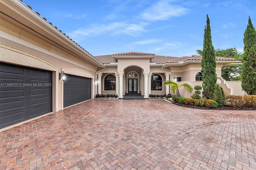 Rear-find gem you will fall in love with, located in the desired Saddle Club estate community. ONE STORY unique triple split bedroom floor plan has 5bd, 6.5 bath PLUS office+formal dining room+family room, 5881 Sqft, volume 14ft ceilings. 
Incredible kitchen, oversized center island& a custom-made pantry.
master bedroom suite with tranquil/spa-like bath & all bedrooms are en-suite. 
great spacious outdoor space for entertaining from the covered patio with a summer kitchen, built-in BBQ & wood-fired pizza oven. outside cabaña bath with an oversized resort-style pool. large yard&lake view 
Newer construction built with impact windows&doors, tile roof & propane generator.   
4 car garage (half currently used as a gym)+room for 8 more cars. The property is fenced & gated. Best school zone