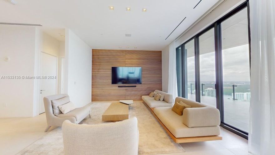 Step into luxury at this boutique-style residence, one of only 63 exclusive units in the building. Boasting 2044 sqft, 2 bedrooms, 2.5 baths, and a chef's kitchen with Wolf and Subzero appliances, this tastefully decorated haven exudes elegance at every corner. Floor-to-ceiling windows frame stunning 12 ft ceilings, while a 1000 sq ft terrace with a summer kitchen offers breathtaking sunset views. Enjoy Beach Club amenities, infinity pool, fitness center, sauna, food & beverage services, and automated parking. Welcome to a life of unparalleled elegance and comfort.