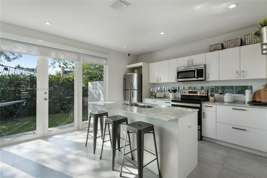 Beautifully appointed, modern two-story townhome on private street. Enter this fabulous 3 bed / 2.5 bath condo-townhouse w/ porcelain floors throughout, kitchen w/ marble countertops & stainless steel appliances. Fully fenced + covered parking. Minutes from Brickell, Downtown Miami, Coral Gables & Coconut Grove. A must see!