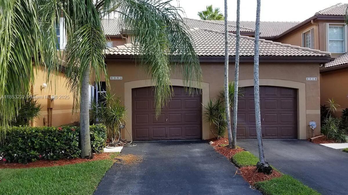 Welcome to 1354 Veracruz Ln in Weston, FL 33327 This charming home offers a spacious layout with bright and airy interiors. The property features a beautifully landscaped yard, a modern kitchen with updated appliances, and a comfortable living area appropriate for entertaining. The serene backyard provides a peaceful retreat, and the location offers convenient access to local amenities and recreational spots. Experience the best of Weston living in this inviting residence.