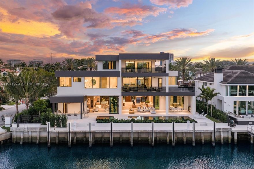 Where privacy, scale, and waterfront living converge, this newly constructed contemporary estate is situated within the guard-gated enclave of Harbor Beach. Encompassing 9,135 square feet of interior living space, the residence offers six bedrooms, seven full bathrooms and two half bathrooms across three expansive stories and is envisioned to capture panoramic views of the Intracoastal Waterway and New River, extending from the Fort Lauderdale skyline to Bahia Mar and the Atlantic horizon.

The home is set on a 14,300-square-foot lot and complemented by expansive covered outdoor areas curated for elevated waterfront entertaining. The property features 110 feet of deep-water frontage with a private dock capable of accommodating a mega yacht, positioned along a protected canal setting with swift access to open ocean.

Architectural highlights include a dramatic bridge entry with waterfall feature, elevator access to all levels, gated entry, and an air-conditioned garage accommodating up to eight vehicles, with a layout incorporating a private media or recreation room, home office, and a third-story entertainment suite with secondary kitchen and guest accommodations, all within one of Fort Lauderdale’s most exclusive waterfront communities.