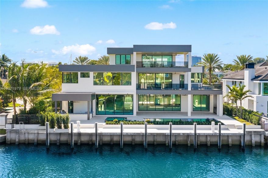 Where privacy, scale, and waterfront living converge, this contemporary estate is situated within the guard-gated enclave of Harbor Beach. Encompassing 9,135 square feet of interior living space, the residence offers six bedrooms, seven full bathrooms and two half bathrooms across three expansive stories and is envisioned to capture panoramic views of the Intracoastal Waterway and New River, extending from the Fort Lauderdale skyline to Bahia Mar and the Atlantic horizon.

Currently under construction and scheduled for completion in March 2026, the home is set on a 14,300-square-foot lot and complemented by expansive covered outdoor areas curated for elevated waterfront entertaining. The property features 110 feet of deep-water frontage with a private dock capable of accommodating a mega yacht, positioned along a protected canal setting with swift access to open ocean.

Architectural highlights include a dramatic bridge entry with waterfall feature, elevator access to all levels, gated entry, and an air-conditioned garage accommodating up to eight vehicles, with a layout incorporating a private media or recreation room, home office, and a third-story entertainment suite with secondary kitchen and guest accommodations, all within one of Fort Lauderdale’s most exclusive waterfront communities.