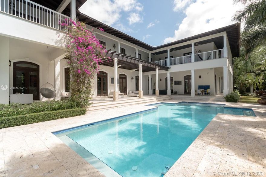 Spectacular moving-in-ready estate, located in desirable Banyan Trail! This gorgeous estate features 5 bedrooms + office/den and 5 full bathrooms, plus an amazing guest house! Interior design by world renowned interior designer Pepe Calderin which includes a spectacular onyx wall, magnificent Snaidero kitchen that blends into the family room, huge master bedroom with a luxurious master bathroom, oversized walk in closets, dining area,exceptional craftsmanship,office, marble floors, complete automatization system and much more! Walk outside into a secluded pool area surrounded by lush landscaping, koi pond and barbecue area. The basketball court and green areas are awaiting for the young ones to enjoy!This estate is perfect for both relaxing with family or entertaining. This is a must see!