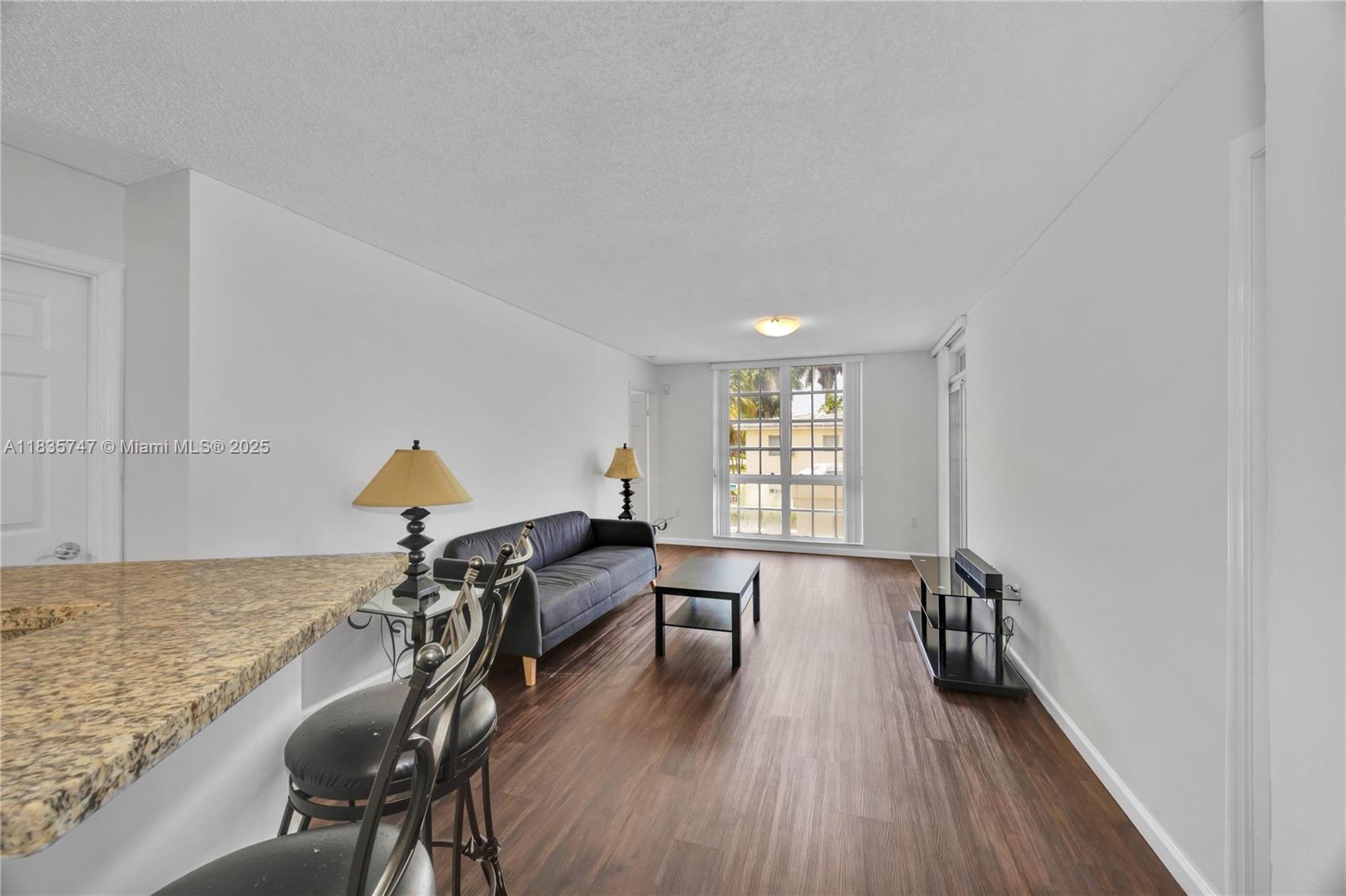 College housing investor opportunity in prime Coral Gables location. This leased corner-unit condo at University Inn provides immediate rental income with tenants in place through June 2026. The unit features wood and vinyl flooring, granite kitchen countertops, and an in-unit washer and dryer. A brand new roof is currently being installed for the entire complex. Community amenities include a pool, Jacuzzi, on-site management, guest parking, an assigned parking space (#89), and a private storage unit (#62). HOA fees cover water, cable, internet, and more. Just steps from the University of Miami, Publix, Whole Foods, and the Metrorail, this turn-key condo offers reliable cash flow and strong long-term potential in one of the area's most desirable rental markets.