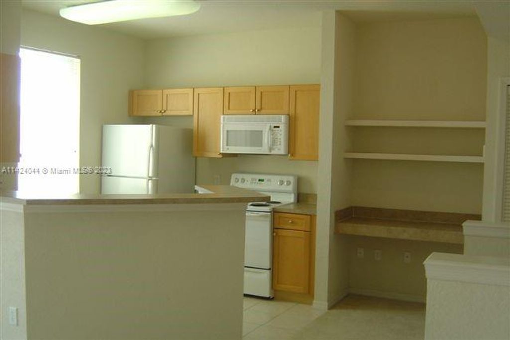 Photo of 11030 Legacy Dr #302, Palm Beach Gardens, FL 33410 (MLS # A11424044)