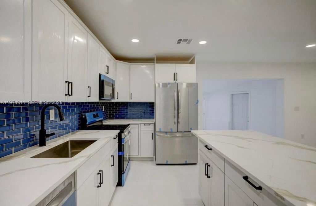 Photo of 1101 NW 14th Ct, Fort Lauderdale, FL 33311 (MLS # A11974811)