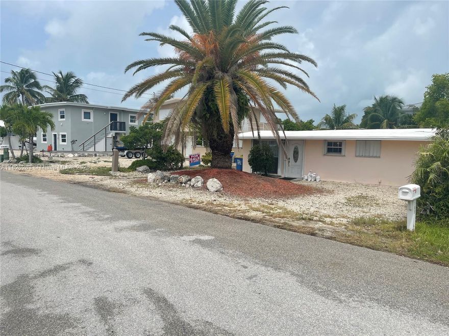 Beautiful cement canal front conch house with 50’ dock and gazebo on the bayside of Tavernier in Islamorada.  Updated bath and kitchen with all appliances and furnishings included throughout the house.  Roof/ceiling structure constructed from termite proof dade pine.  Carpeted bedrooms and tile everywhere else.  AC/heat provided by four quiet mini split units.  Backyard includes grills, a permitted building and a few palm trees by the cement dock This location includes a voluntary HOA for a small park and boat ramp as well as access to Islamorada residents Founders park.  There is also an empty lot next door.  Come get a priced to sell cement waterfront house in the fishing capital of the world and add another level or a pool!