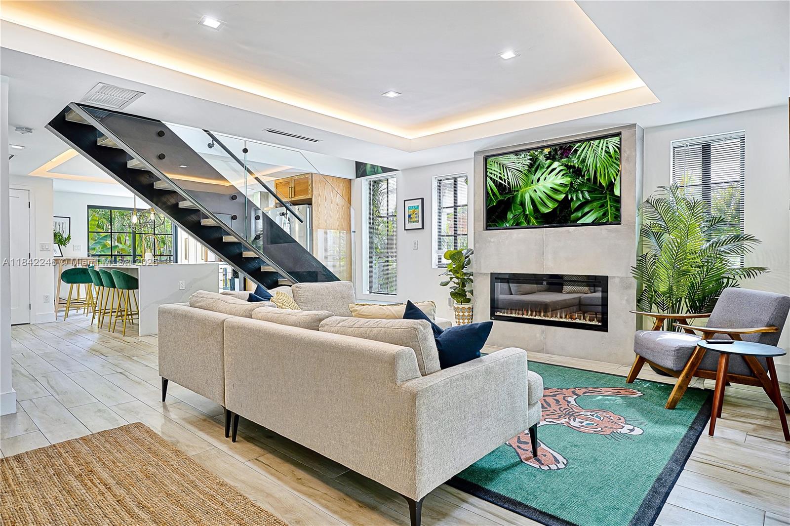 Rare opportunity to rent a furnished 5BD/4BA home in the heart of Shenandoah—just steps from Calle Ocho and minutes to Brickell, Gables & Grove. This tastefully updated home includes one bedroom with private entrance, kitchenette & full bath—ideal for guests, live in nanny or extended family. Spanning 2,600+ SF, it features wood-look tile, high-end appliances, central AC, a dedicated office, two porches & a lush tropical yard. Private parking for 2–3 cars. Available Sept 1. Tenant pays all utilities. Credit/background check required. Shorter-term or seasonal options may be considered at different rates—contact agent. Please note - Guest house in rear rented separately.
