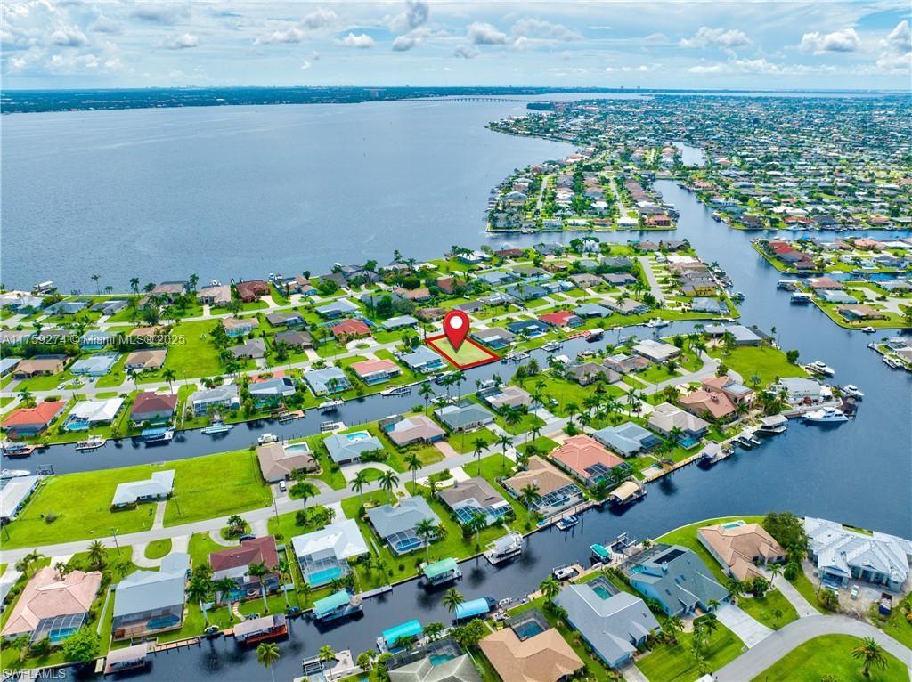 Direct sailboat Access to the Caloosahatchee River, Seawall in place. On water and sewer, and assessments (water, sewer and irrigation) paid in full. Great lot to build your future home or purchase it is an investment. Northern exposure. Few minutes to the river and open waters of Gulf of Mexico.