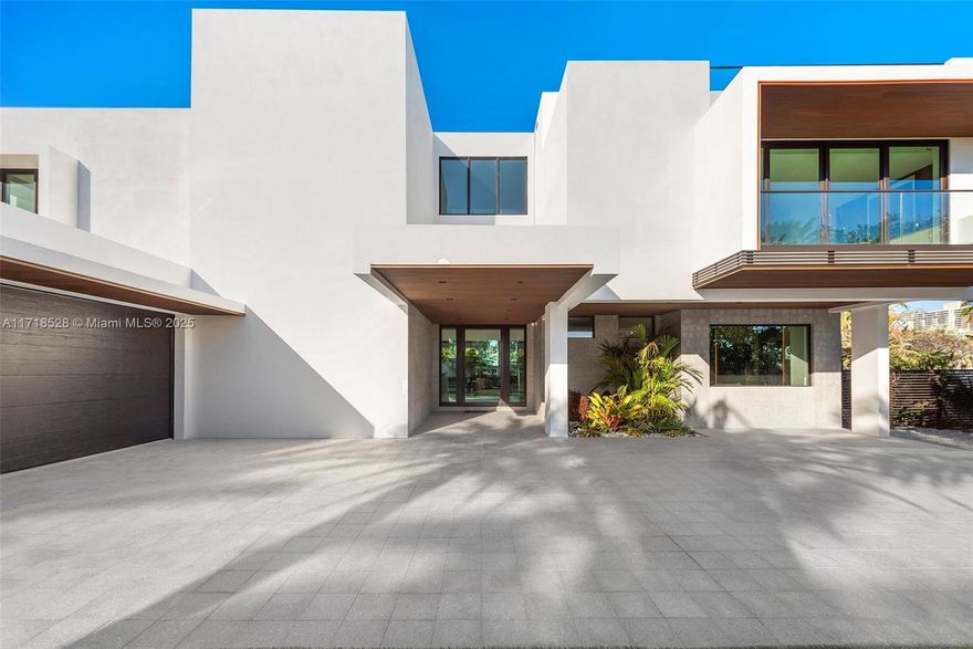 Experience the pinnacle of luxury at 128 Ocean Blvd, Golden Beach, a stunning 3-story estate designed for both entertaining and family living. With nearly 8,000 sqft, the home offers 6 bedrooms, 7 full baths, and 2 half baths, in addition to a custom Italian kitchen by Snaidero, media room, and a luxurious master suite. Seamless indoor-outdoor living is enhanced by an outdoor kitchen by Alfresco and dining area, perfect for hosting year-round. Golden Beach provides unmatched privacy with its own police force, private beach, tennis courts, and a new residents-only community center. Just minutes away from fine dining, luxury shopping, and cultural attractions, this home blends seclusion with convenience.