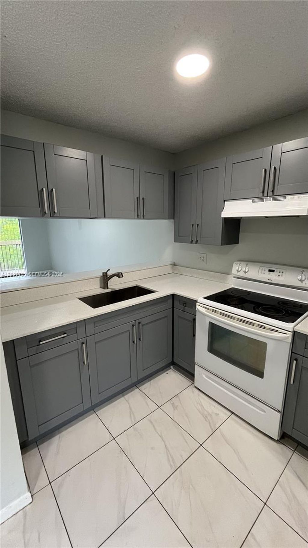 Photo of 4010 Lakeside Drive #4010, Tamarac, FL 33319 (MLS # A12005738)