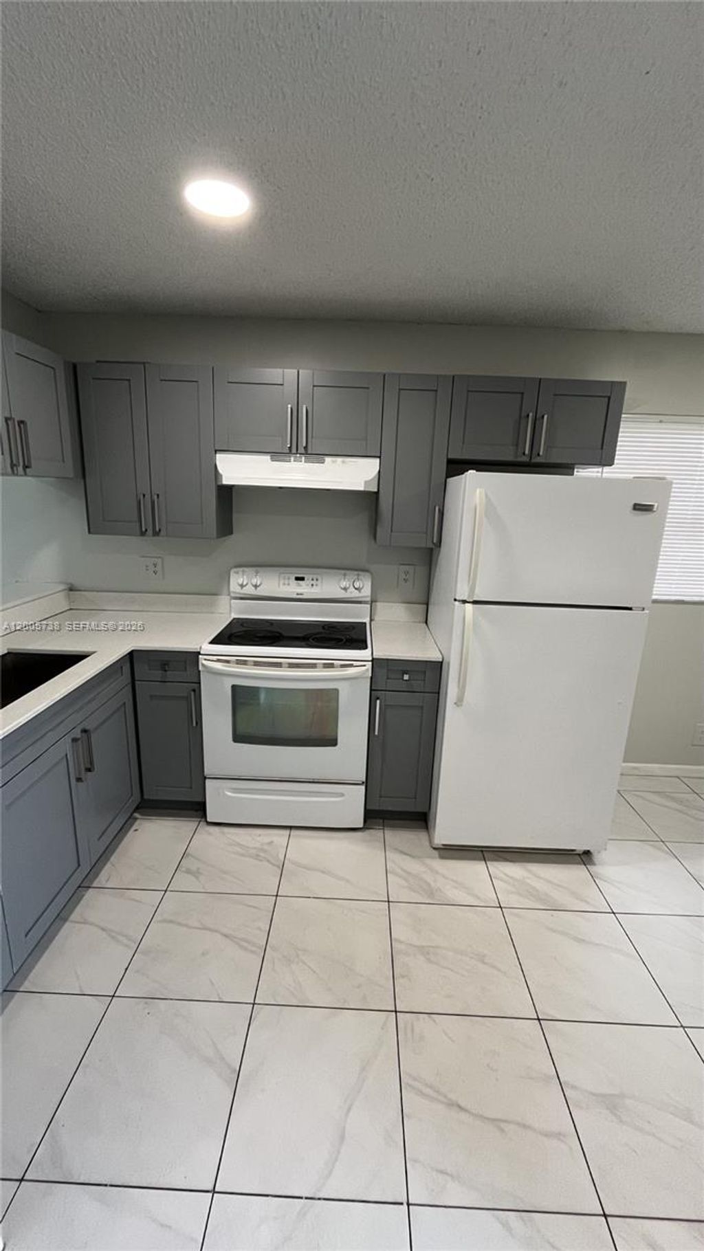 Photo of 4010 Lakeside Drive #4010, Tamarac, FL 33319 (MLS # A12005738)