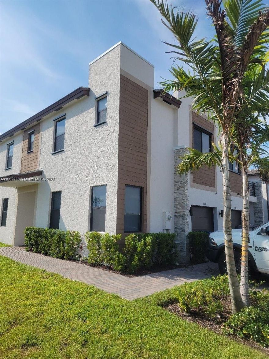 Beautiful and modern corner unit located at 796 NE 208th Ter #796, Miami Gardens, FL 33179. This spacious home features elegant porcelain floors downstairs and warm wood laminate upstairs, offering both style and comfort. The sleek kitchen boasts quartz countertops, perfect for cooking and entertaining. Enjoy added privacy and outdoor living with a fenced-in patio area. As a corner unit, it provides extra natural light and more space. Situated in an excellent location with easy access to major highways, shopping, and schools. Don’t miss the opportunity to live in this contemporary and well-appointed home!