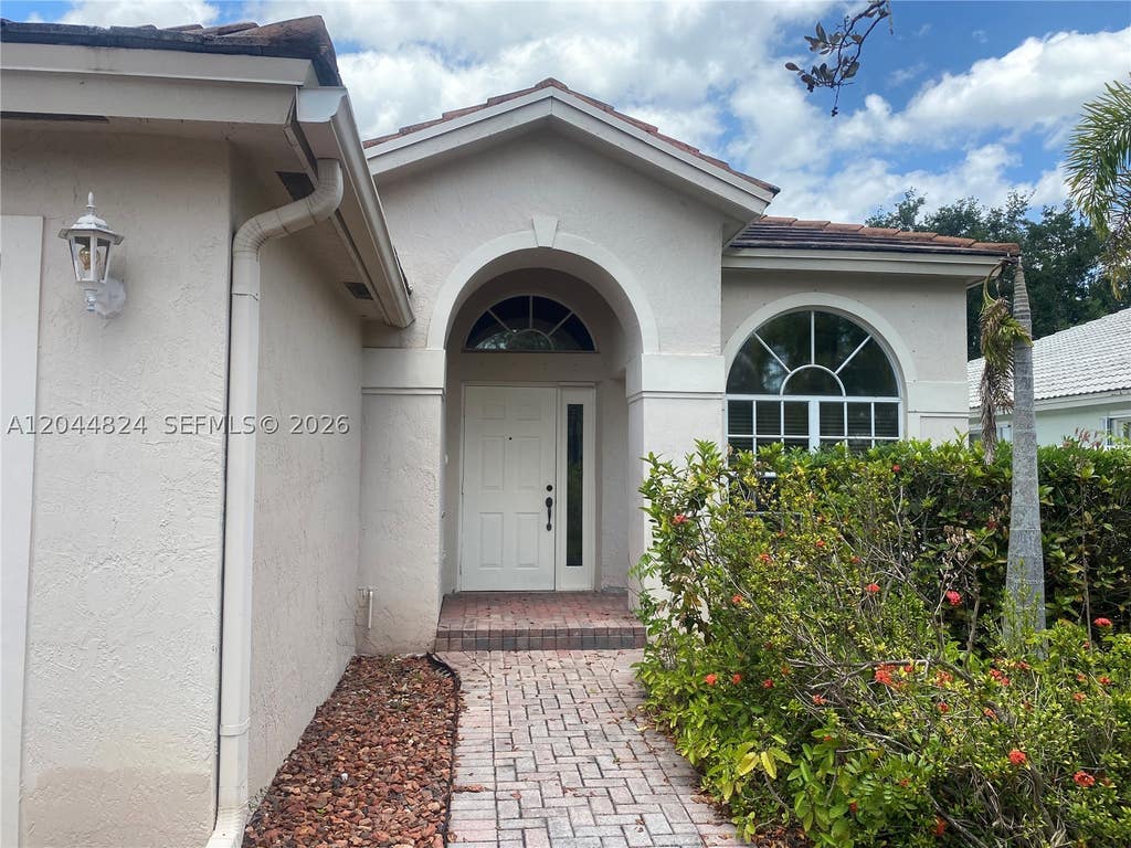 Photo of 1315 NW 143rd Ave #1315, Pembroke Pines, FL 33028 (MLS # A12044824)