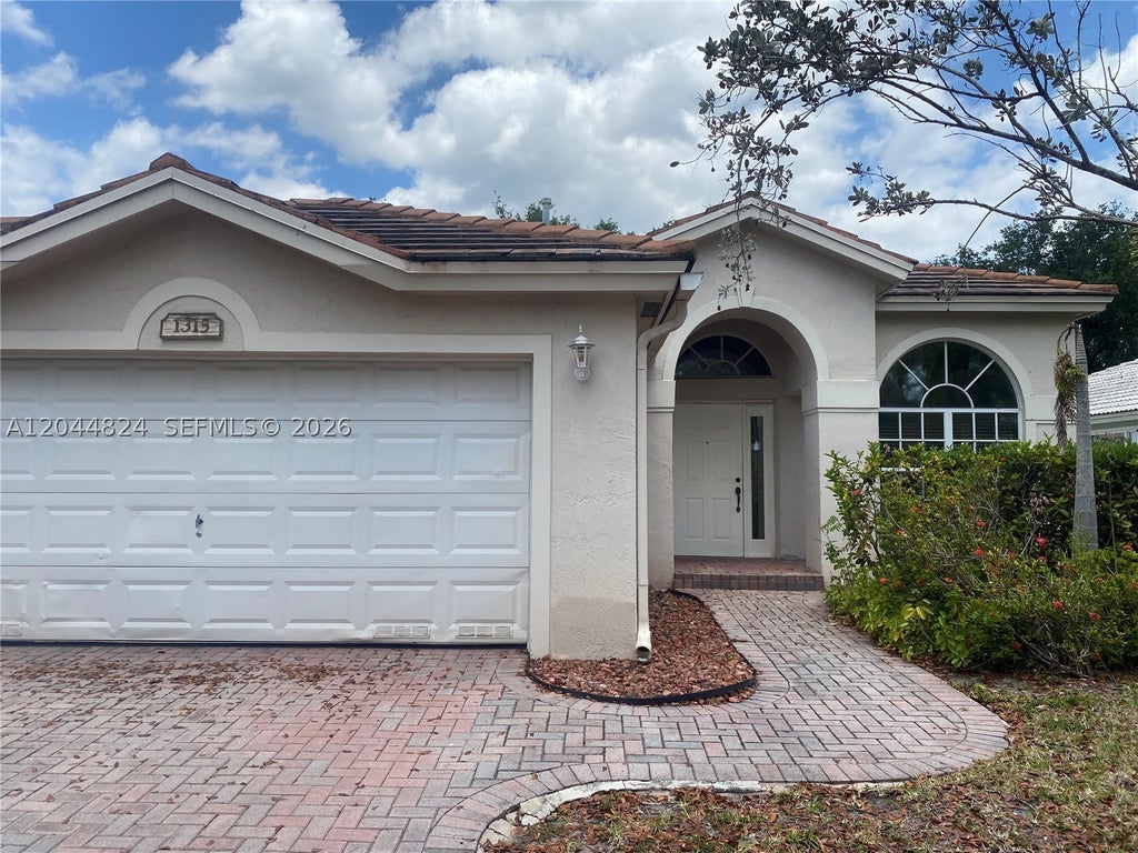 Photo of 1315 NW 143rd Ave #1315, Pembroke Pines, FL 33028 (MLS # A12044824)