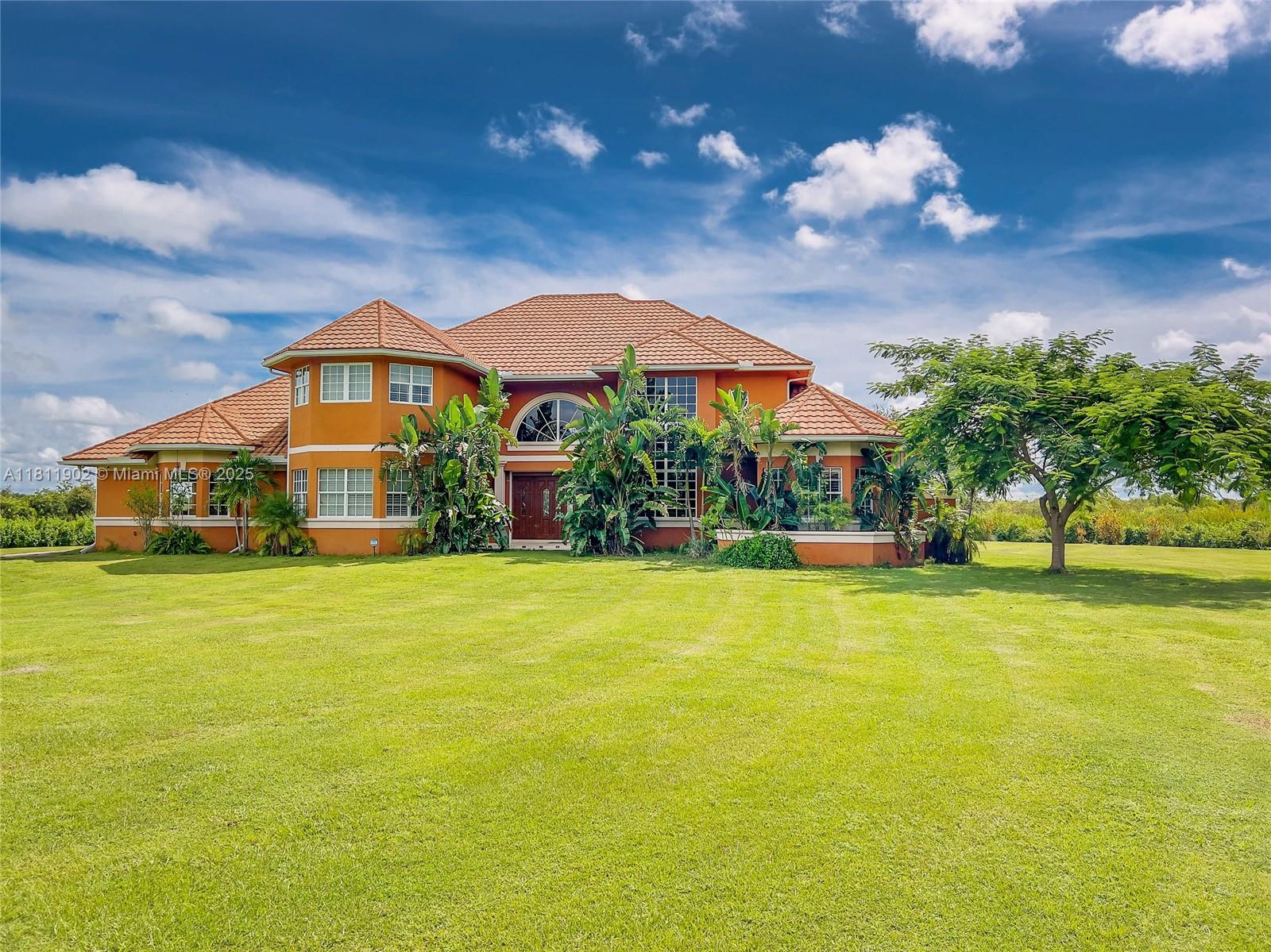 Breathtaking waterfront estate offers privacy, a custom main house of 7181 sq ft of ultimate luxury w/4 en-suites, pool bath & half bath, 3/3 guest house with 6 car garage, acreage, private boat ramp & dock. Built to withstand CAT 5 hurricanes, both houses with no damage to buildings or roofs from past hurricanes, X flood zone. Two Masters offer his/her vanities, custom closets, rain showers & Jacuzzis. Flooring is travertine/marble/onyx & wood. Gourmet kitchen with Brookwood cabinetry & “jeweled” granite countertops, double sinks, double ovens, bread warmer, island with gas cooktop, breakfast nook, wine room, huge walk-in pantry, & vast great room with a custom bar. Plantation shutters, wraparound waterfront veranda & private balconies up, elevator shaft, whole house security system.