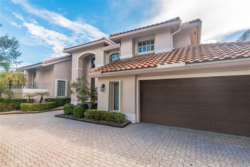 Beautiful executive home located in the highly sought after Grand Palms community of Pembroke Pines. This impressive 5-bedroom property features real wood floors, plantation shutters, a gourmet eat-in kitchen, Thermador appliances, remodeled bathrooms, spacious bedrooms, ample storage, and a stunning primary bedroom with volume ceilings and an upscale bath. A large, covered patio leads directly to a resort-style back yard that includes a resurfaced heated pool & spa, new travertine flooring, a large pergola with built-in bar and summer kitchen as well as an outdoor shower and maintenance-free artificial grass. New roof installed in 2020 along with a finished garage and tankless water heating system. It's a rare opportunity to own a turnkey, luxury home in the heart of south Broward.