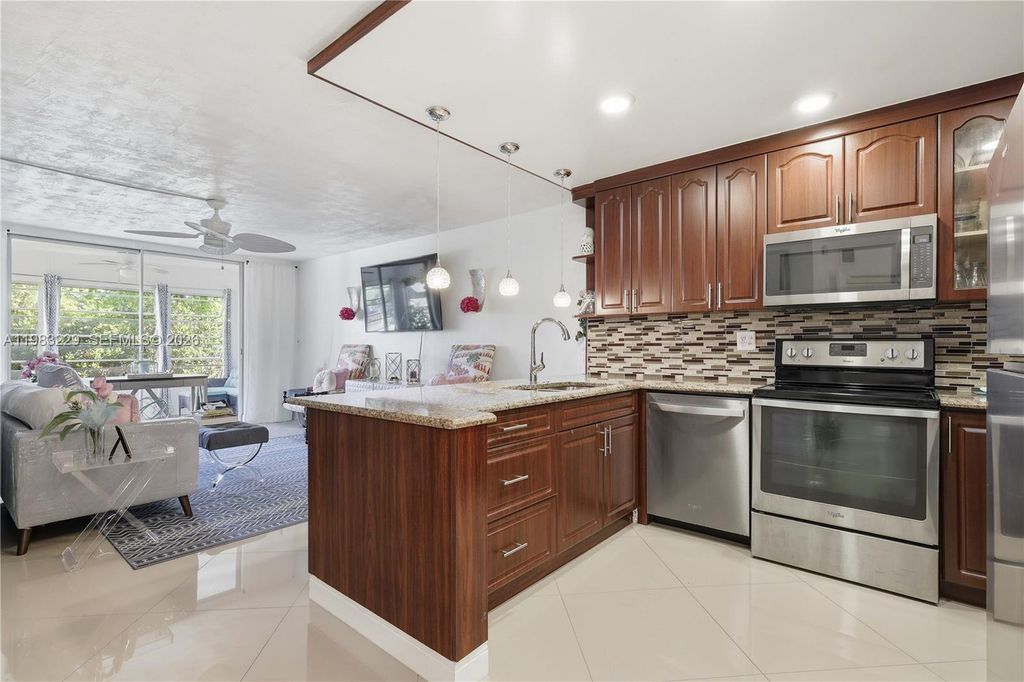 Photo of 7100 NW 17th St #210, Plantation, FL 33313 (MLS # A11983229)