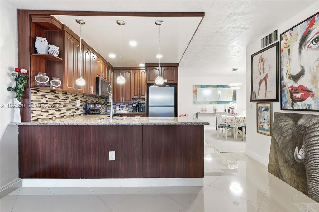 Photo of 7100 NW 17th St #210, Plantation, FL 33313 (MLS # A11983229)