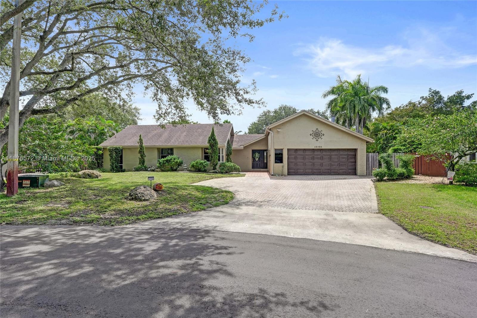 Cul-de-sac pool home in the desirable Rock Creek community of Cooper City/Hollywood! This 3-bed, 2-bath gem sits on a private 13,000+ sq ft lot backing onto a greenbelt. Vaulted ceilings, ceramic tile floors in bathrooms/LPV in all other living areas, create a warm, open feel. French doors lead to a screened patio and fully paved pool deck—perfect for entertaining. Updated kitchen and living areas feature quartzite waterfall counters and 2022 appliances. Roof replaced 7 years ago. 2-car garage, $200 quarterly HOA with access to parks, tennis center, and trails. Zoned for top-rated schools and close to dining, shopping, and highways. Private cul-de-sac park, illuminated walking trail, community pool, tennis, basketball and gym.