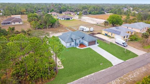 Tiny photo for 705 8th Ave, Lehigh Acres, FL 33972 (MLS # A12027873)