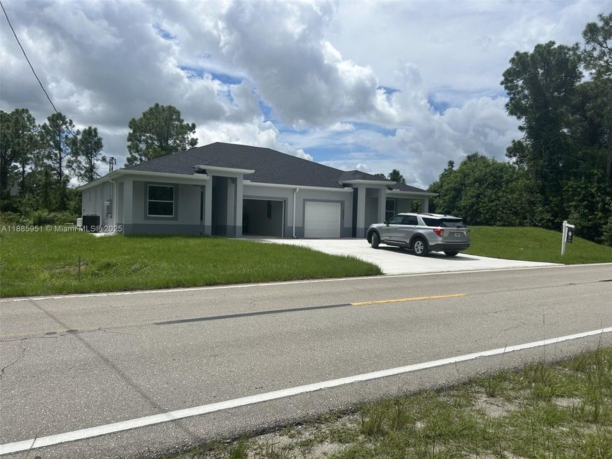Step into modern, effortless living at this pristine 2025-built duplex, situated on 200/202 E 12th St in the rapidly expanding Lehigh Acres community. Each mirror-image unit features three generously sized bedrooms and two bathrooms outfitted with high-end fixtures and elegant finishes. Sunlight floods the open-concept kitchens and living areas, where sleek cabinetry, premium appliances, and stylish countertops invite both everyday meals and entertaining. Every bedroom offers a finished closet, enjoy the convenience and security of a private attached garage. Built for quality and comfort, the home's features include durable block-and-stucco construction, tile flooring throughout, impact-resistant windows, a water softener, well water and septic setup. Set on a spacious 0.24-acre lot