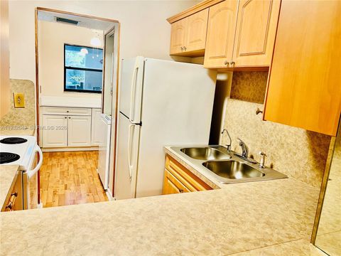 Photo of 1021 Mockingbird Ln #215, Plantation, FL 33324 (MLS # A11932043)