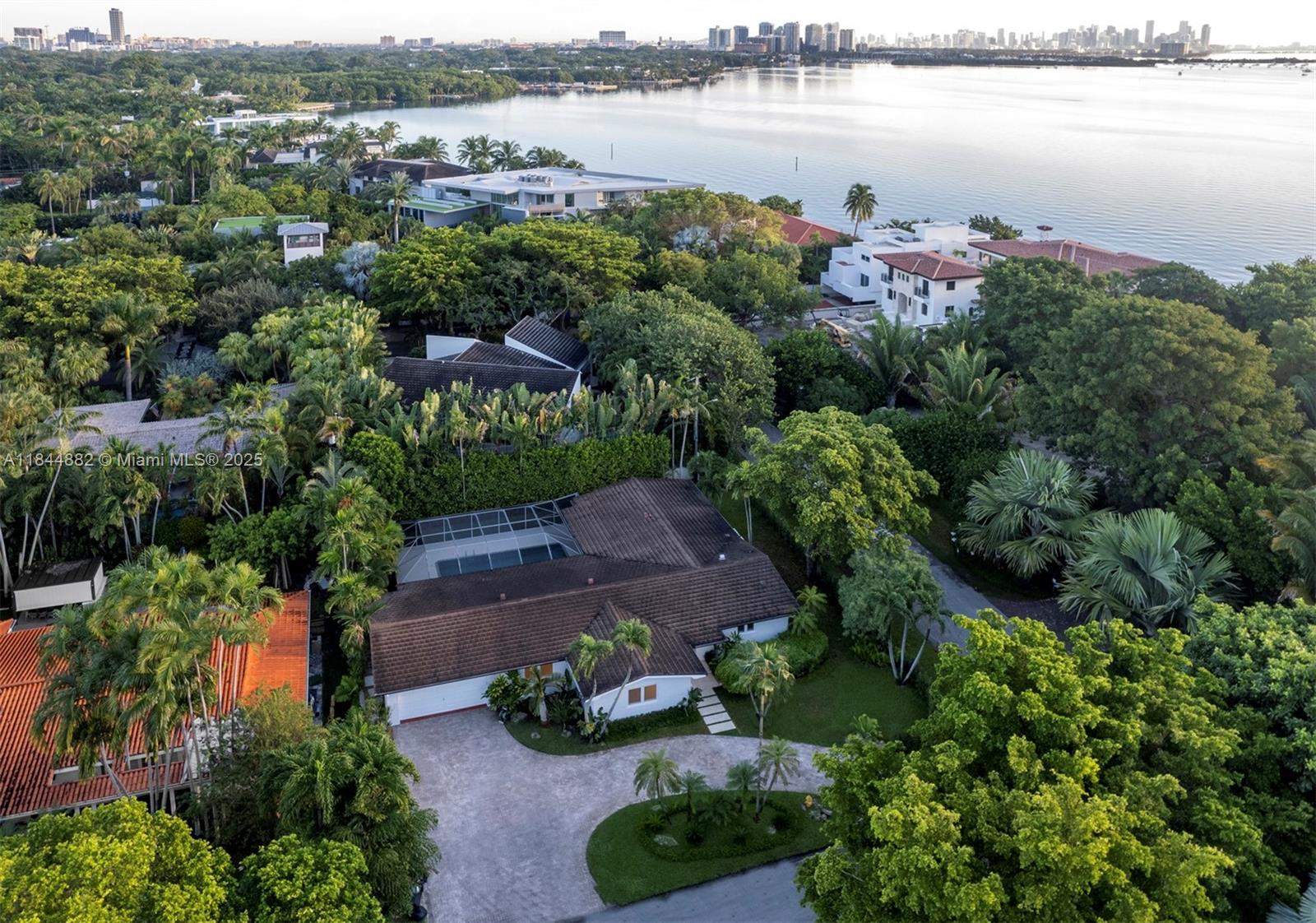 Located in the prestigious Coral Gables neighborhood, this fully renovated (2024) 4BD/3BA corner-lot home offers an open floor plan with spacious living room/dining room/kitchen and a 30'x15' screened pool with child safety fence. The kitchen features custom cabinetry, Italian countertops, and a pantry/laundry room with cabinets. Upgrades include new porcelain flooring, doors, recessed baseboards, lighting, electrical, plumbing, AC, fresh interior/exterior paint, impact windows/doors, newer roof, EV charger, and smart tech: Sonos, Nest, Ring, and Lutron—all phone controlled. Three bedrooms have walk-in closets; built-ins in dining/TV areas. Near CocoWalk and within 2 miles of top-rated schools and preschools. Quiet neighborhood.