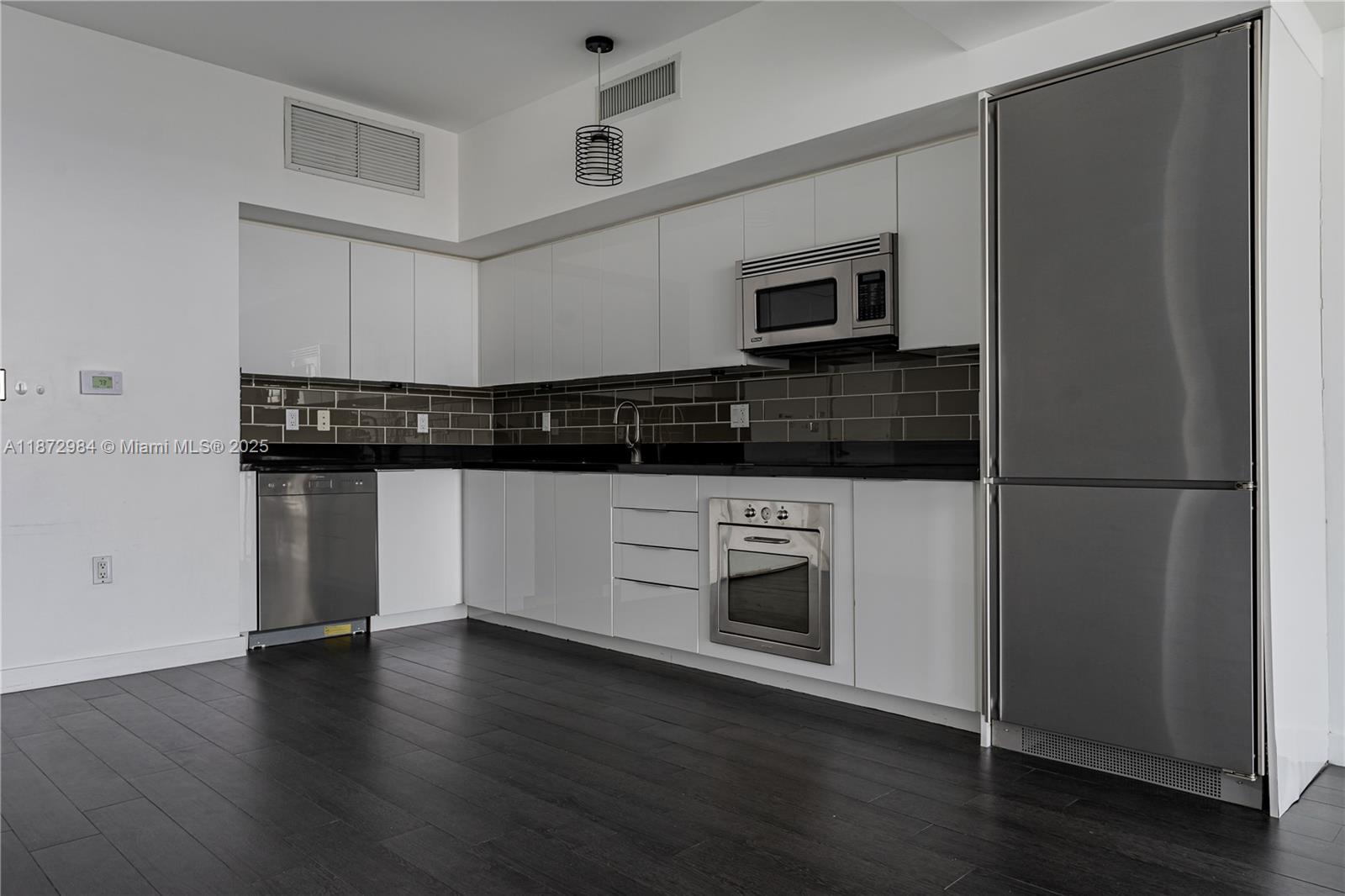 Soar above the city in this gorgeous 45th-floor 1BR/1BA at The Mint Riverfront! Perfect floor-to-ceiling windows fill this space with plenty of natural light, framing the sweeping skyline and stunning Miami sunset views! Modern finishes include sleek white cabinetry, SMEG stainless steel appliances, dark tile floors, and well kept bath w/ shower! Enjoy a smart, open layout with a private balcony and in-unit washer/dryer. Offering 5-star, resort-style amenities: pool, fitness center, spa, sauna, lounge areas, concierge, and 24/7 security. Perfectly located minutes from Brickell, Downtown, Wynwood, Miami Beach, and MIA Airport with instant I-95 access. Impeccably maintained and move-in ready, this residence delivers the lifestyle you deserve in one of Brickell’s most sought-after buildings.