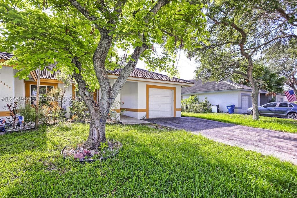 Photo of 2375 NW 123rd Ave, Coral Springs, FL 33065 (MLS # A12049310)