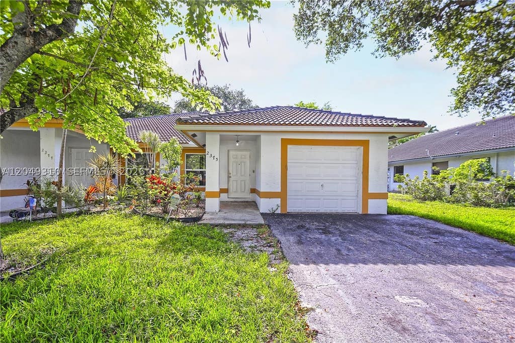 Photo of 2375 NW 123rd Ave, Coral Springs, FL 33065 (MLS # A12049310)