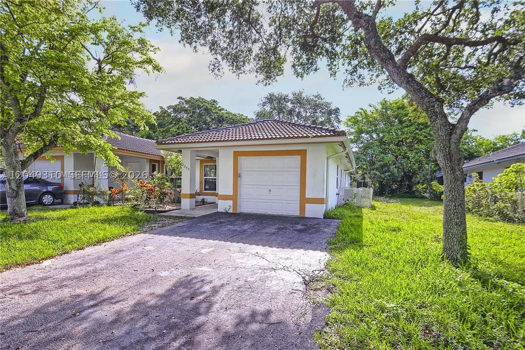 Photo of 2375 NW 123rd Ave, Coral Springs, FL 33065 (MLS # A12049310)