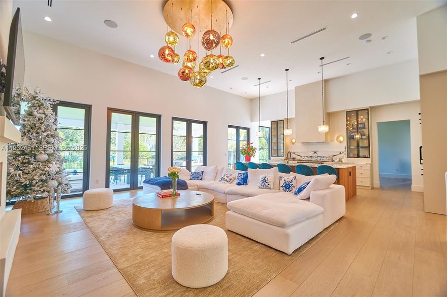 This exceptional Contemporary Modern Farmhouse is located in the heart of Pinecrest on a private dead-end street with tranquil canal views on two sides. Offering approximately 6,389 square feet, the residence showcases natural white oak flooring and a thoughtfully designed indoor-outdoor living concept. The home features five bedrooms, a dedicated office, and an expansive upper-level flex space ideal for a gym, media room, or additional living area. Includes 6.5 bathrooms and a two-car garage with lift capacity. A truly unique and private retreat.