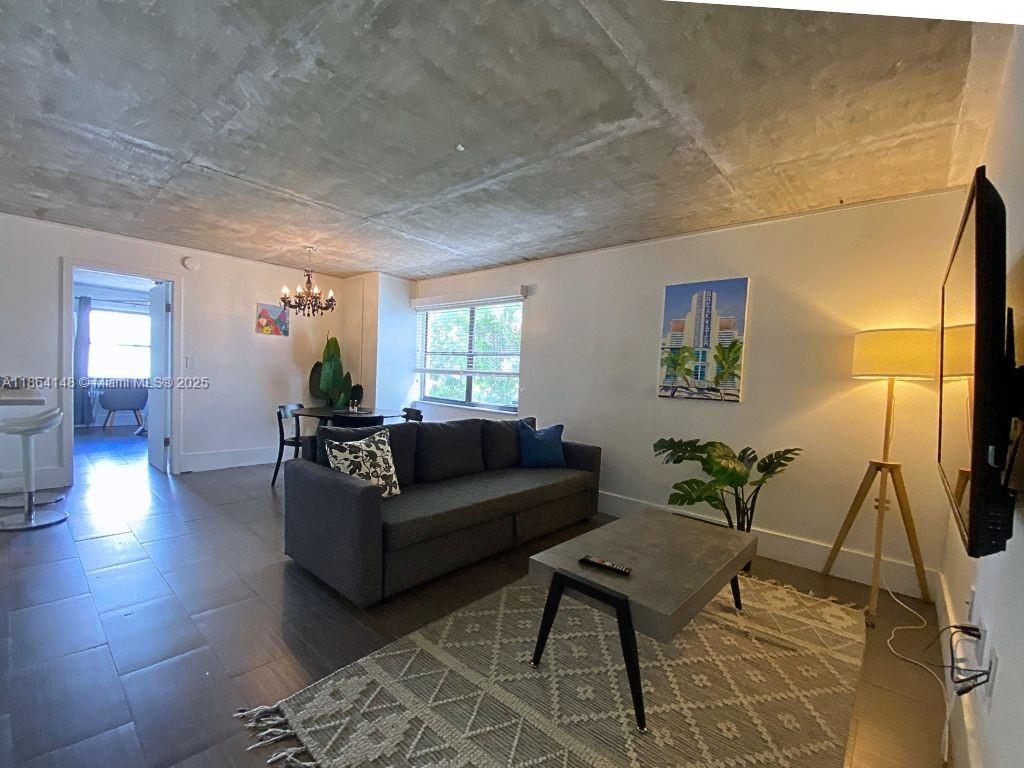Tucked away in one of the most charming buildings in South Beach, this 1-bed, 1-bath corner unit is a serene, sunlit escape. With windows on three sides, natural light flows freely through the open layout, highlighting clean lines, a renovated kitchen, and warm wood floors. Just steps from Flamingo Park and a short walk to the beach, this home blends quiet retreat with unbeatable location. Whether you're enjoying your morning coffee with a breeze from the palm trees or heading out to explore everything SoBe has to offer, this is where simplicity meets lifestyle. Offered fully furnished in a boutique building that whispers charm and calm in the middle of it all.