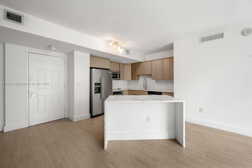 Nothing compares to this apartment with new tiled floors, new paint, new air condition, includes water, internet access, cable tv and (2) assigned parking spaces in the gated garage at the exclusive Veranda in Plantation. A five minute walk from your door at Veranda can take you to a tree-lined path around a serene lake, or to a charming village center where you'll find everything from morning coffee and grocery shopping, to local banks and your favorite pizza. Amenities include, Granite Countertops, Stainless Steel Kitchen Appliances, European Cabinetry, Marble Shower and Soaking Bathtub, Smart Key FOB Entry into Building, Washer and Dryer, Resort-Style Tropical Pool and Jacuzzi, 24-Hour Manned Security at Front Desk, High-Tech Security System-Fitness Center, Sauna and much more.