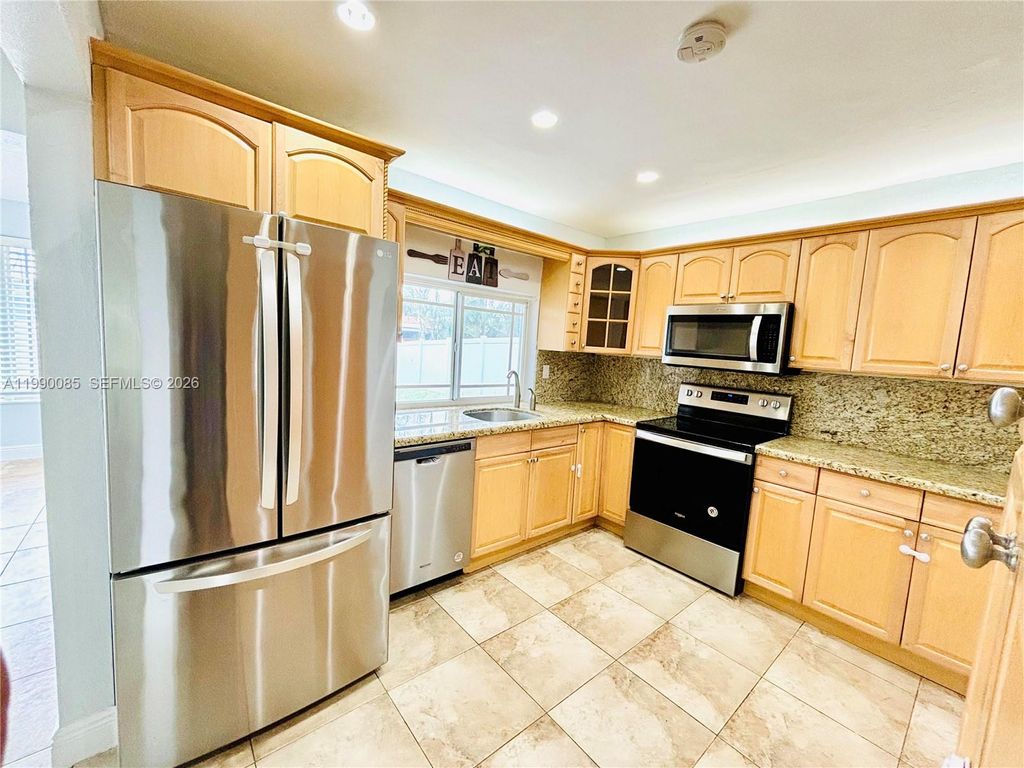 Photo of 8690 NW 16th St, Pembroke Pines, FL 33024 (MLS # A11990085)