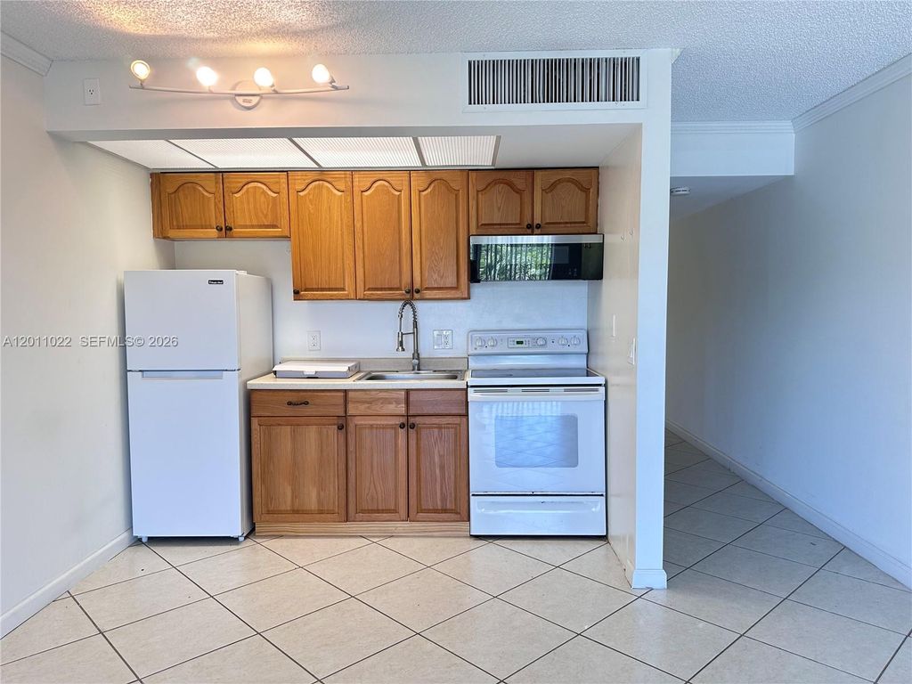 Photo of 13455 SW 16th Ct #311F, Pembroke Pines, FL 33027 (MLS # A12011022)