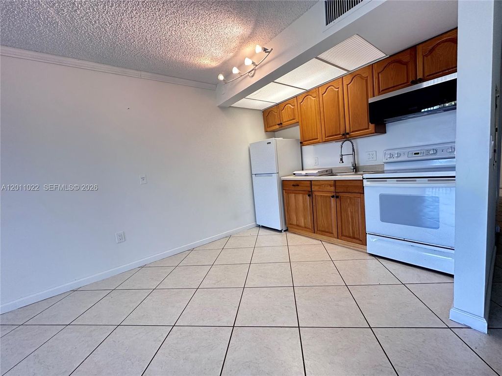 Photo of 13455 SW 16th Ct #311F, Pembroke Pines, FL 33027 (MLS # A12011022)