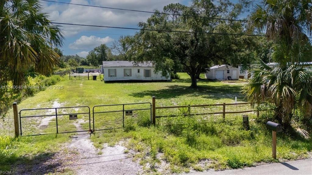 Spacious 0.55-acre lot, zoned for mobile homes, fully fenced, and ready for your vision. The property features a water well completed in 2024 and includes a mobile home (22 ft x 40 ft) with 2 bedrooms, 2 bathrooms, a living room, and a kitchen—the mobile home has not been installed, giving the buyer the opportunity to place and finish it as desired. No value has been assigned to the mobile home in the sale. The previous owner obtained an approved septic system permit. The buyer will be responsible for transferring the permit into their name and completing the septic installation. At the back of the property, there is a 12 ft x 30 ft shed, as well as several fruit trees that add charm and functionality. Please note: The RV shown in photos is not included in the sale.