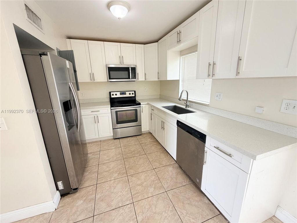 Photo of 7505 Kimberly Blvd #125, North Lauderdale, FL 33068 (MLS # A11992370)