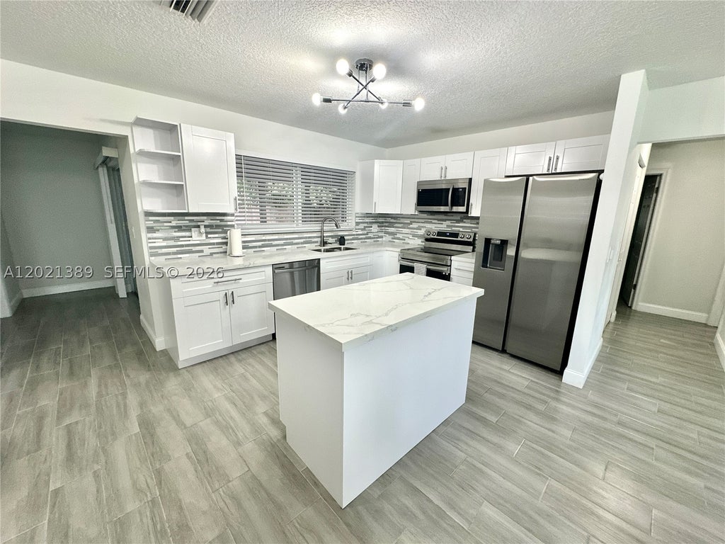 Photo of 3511 Quentin Ave, Boynton Beach, FL 33436 (MLS # A12021389)